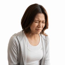 足もみを受けてめっちゃ痛そうにしている女性のイメージ